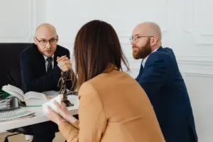 Lawyers consulting a client in a meeting